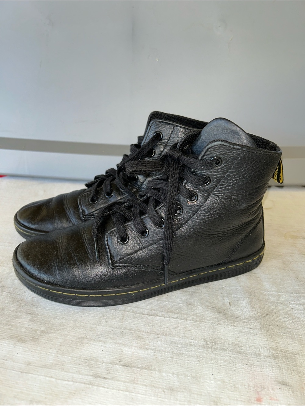Dr. Martens Black Leather High-Top Lace-Up Boots with Yellow Stitching
